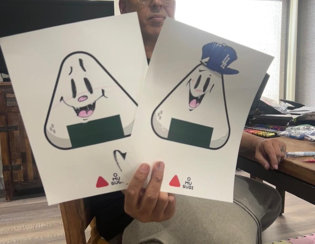 Slick holding a fan of three character sheets